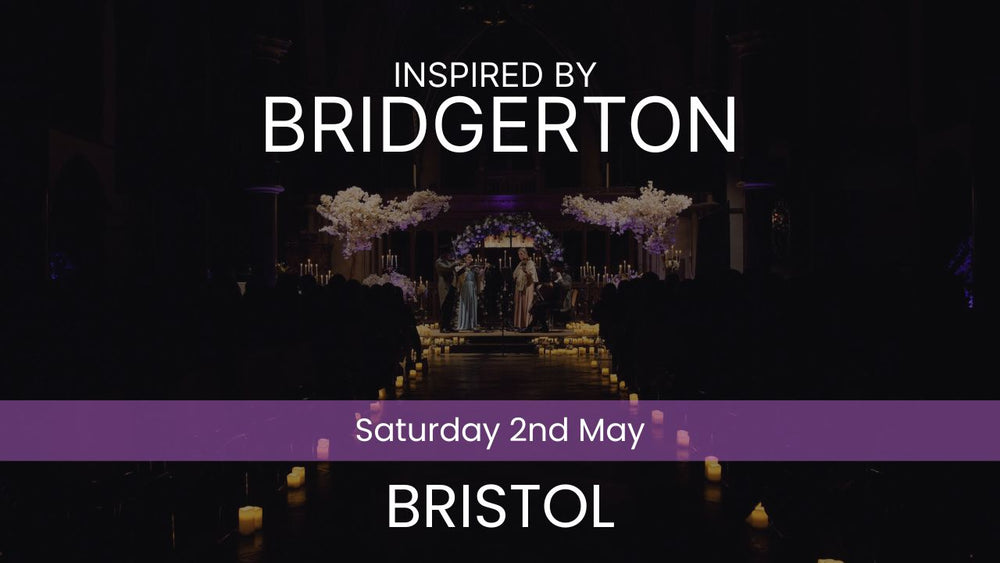 Two musicians playing violin and cello in a decorated indoor setting with candles and floral arrangements. Inspired by Bridgerton Saturday 2nd May Bristol