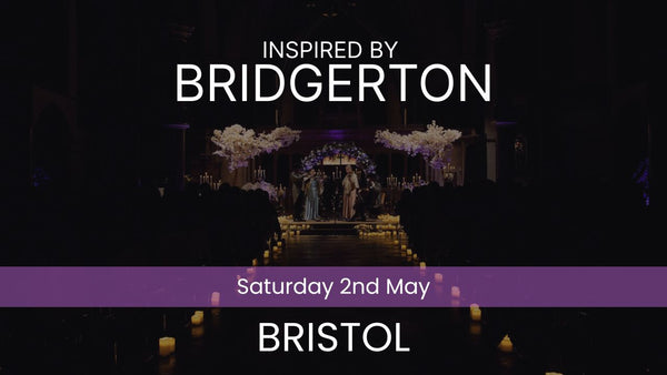 Two musicians playing violin and cello in a decorated indoor setting with candles and floral arrangements. Inspired by Bridgerton Saturday 2nd May Bristol